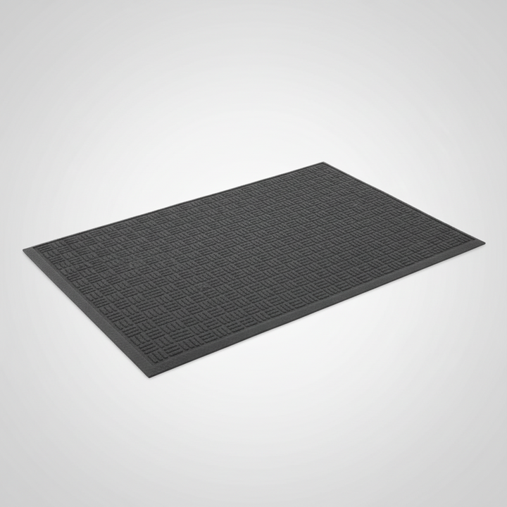 Compact black drum mat on showroom floor – 5ft × 3ft non-slip