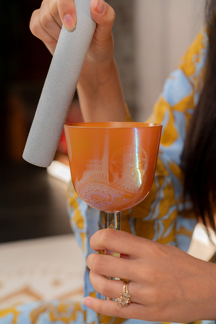  Suede mallet placed beside the 3.75" Essence Solfeggio Crystal Singing Bowl.