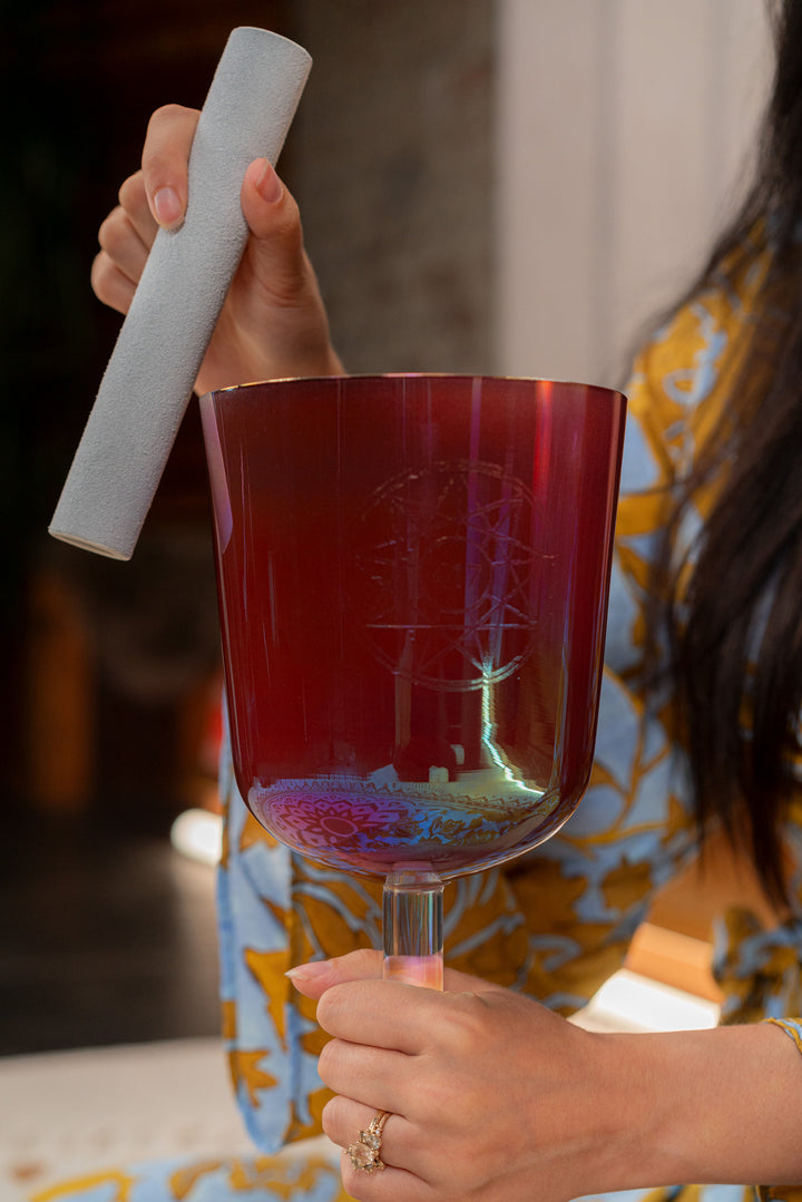 Suede mallet placed beside the 5.75" Essence Solfeggio Crystal Singing Bowl.