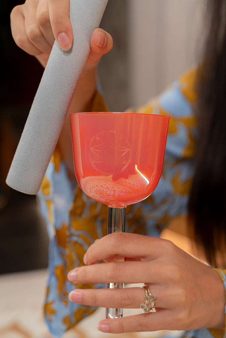 Suede mallet placed beside the 3.25" Essence Solfeggio Crystal Singing Bowl.