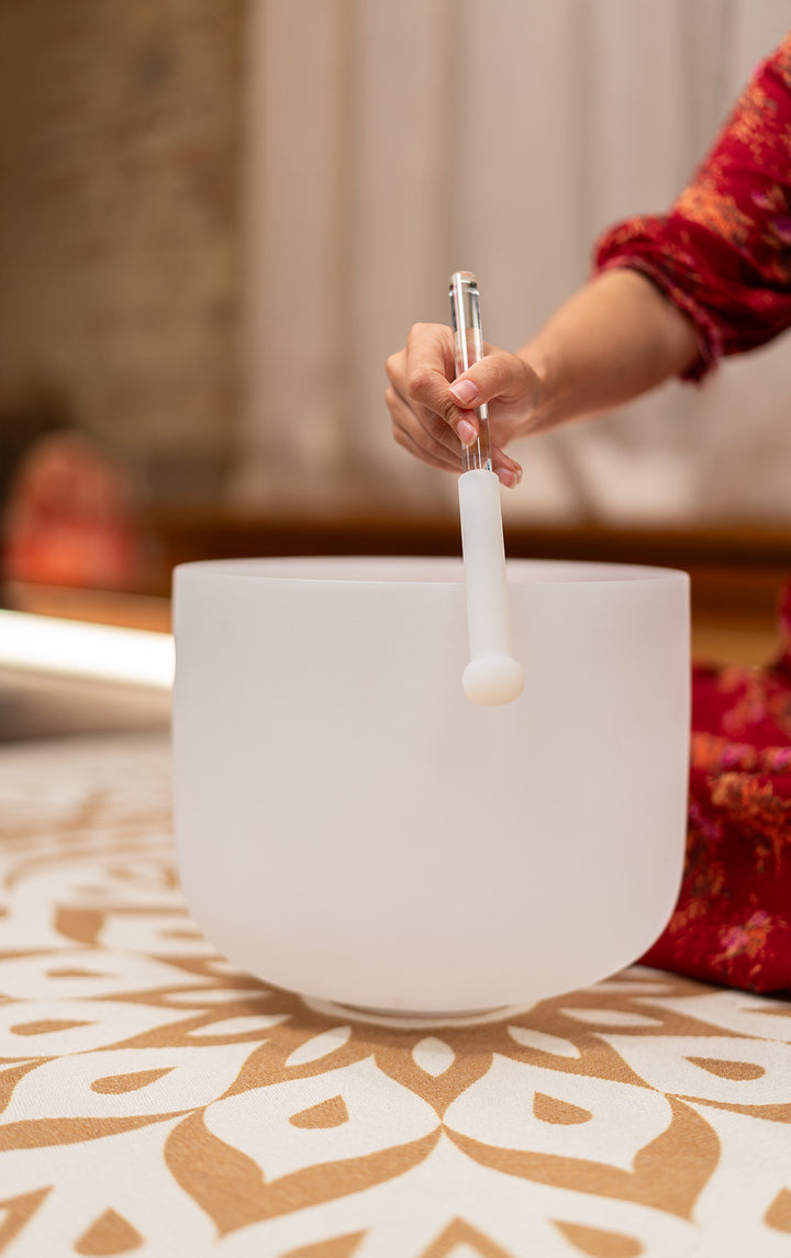 Meinl Sonic Energy Medium Half-Coated Crystal Singing Bowl Rod in use with a crystal singing bowl, producing refined vibrations.