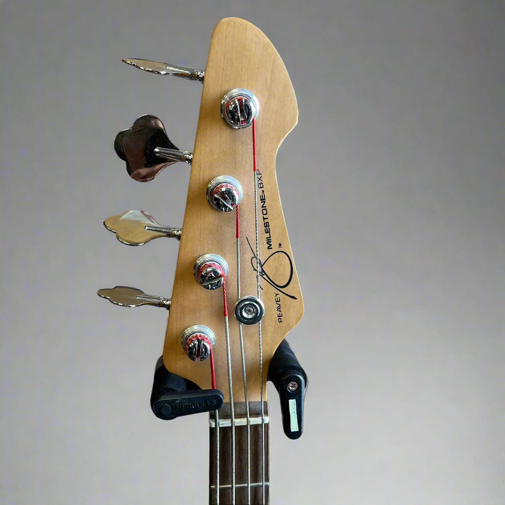 Close-up of Peavey Milestone BXP dark wood fingerboard and frets


