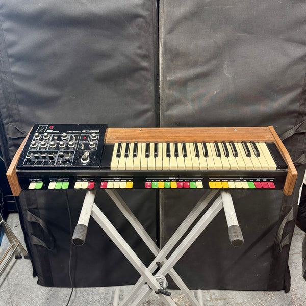 Pre-owned Roland SH-1000 synthesizer showing 37-note keyboard and colourful preset tabs