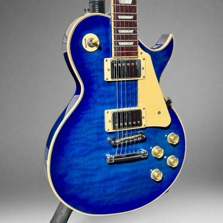 Guitar headstock with 'East Coast' branding on a plain background