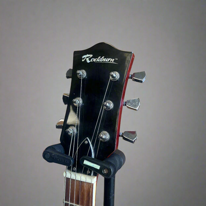 Headstock and tuners of used Rockburn electric guitar

