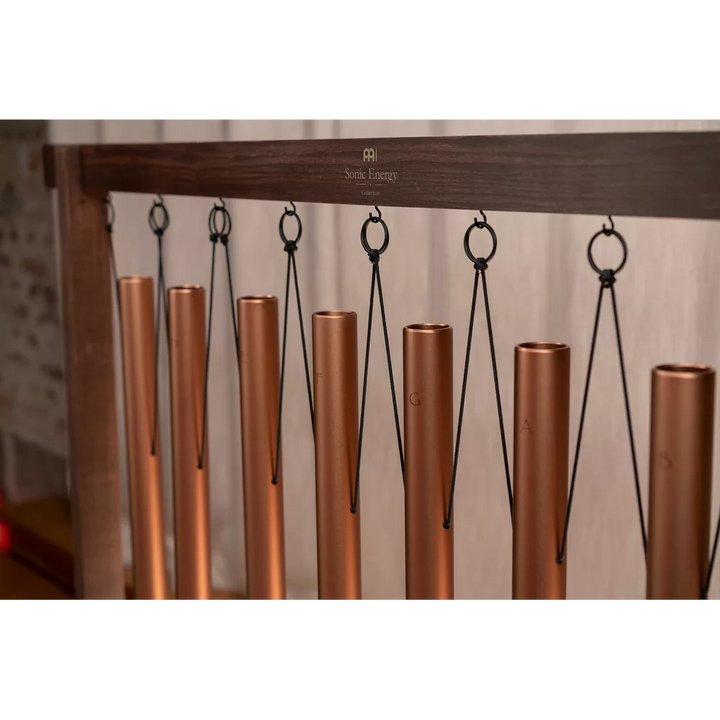 Wooden holders for moving chimes during sound bath