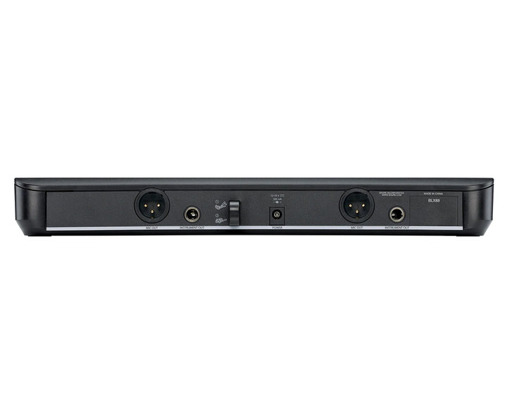 Back view of a black electronic device with various ports on a white background