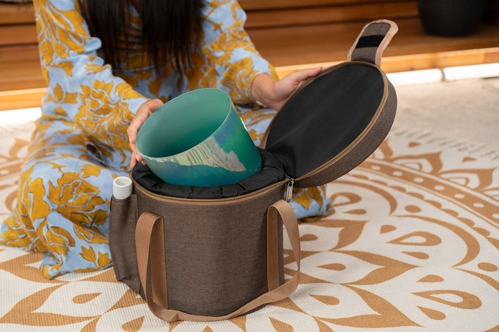 Protective carrying bag holding the crystal singing bowl securely.