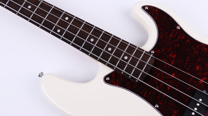 Canadian maple neck and laurel fingerboard of the Gould P Style Bass Guitar in Cream.